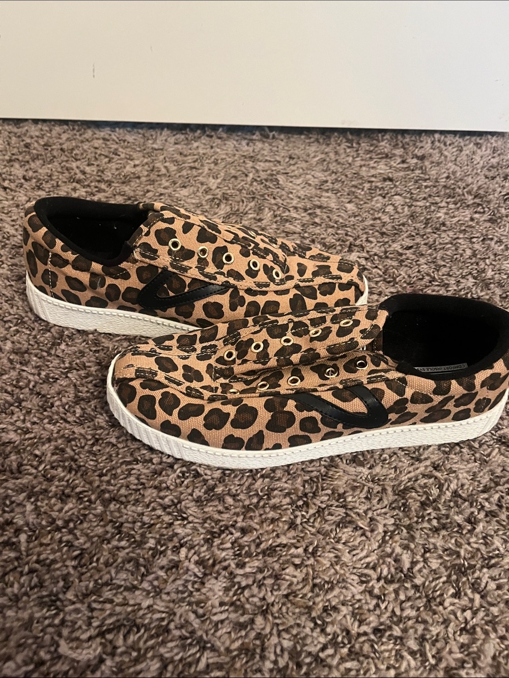 Tretorn Leopard Print Slip-On Sneakers in Tan and Black